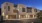 exterior view of apartment building with attached garages at night
