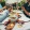 a group of people having a meal around an outdoor table